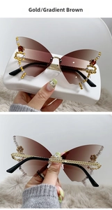 Detail of butterfly rimless sunglasses with gradient lenses and sparkling rhinestones