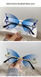 Detail of butterfly rimless sunglasses with blue gradient lenses and rhinestone accents
