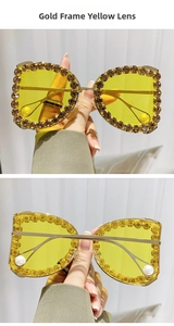 Detail of gold oversized sunglasses with rhinestones, yellow lenses and pearl tips