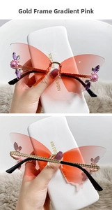 Detail of butterfly-shaped rimless sunglasses with pink gradient lenses and crystal flowers