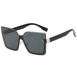 Retro rimless oversized square sunglasses with black lenses and gold metal details