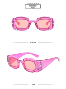 Dettaglio degli occhiali da sole Y2K rosa con montatura a fiore e lenti arancioni