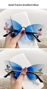 Detail of gold-framed gradient blue butterfly sunglasses with crystal accents and chain arms
