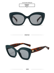 Detail of cat-eye sunglasses with green matte frames and tortoiseshell temples