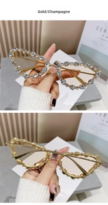 Close-up of luxury gold frame sunglasses with champagne lenses and rhinestone embellishments