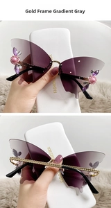 Detail of rimless butterfly sunglasses with purple gradient lenses and floral rhinestones
