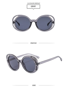 Détail macro de montures de lunettes de soleil rondes grises avec design ajouré