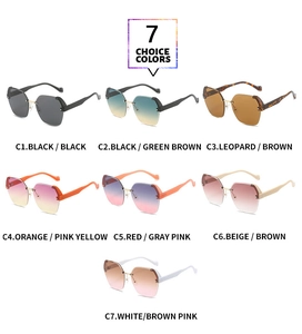 Close-up of frameless sunglasses featuring detailed metal bridges and vibrant gradient lenses