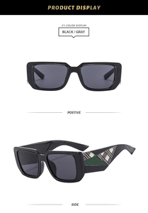 Detail of square oversized sunglasses with unique geometric pattern and plaid on temples
