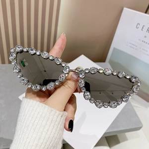 Luxury cat eye sunglasses with silver crystal-encrusted frames and dark grey lenses