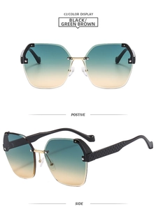Detail view of rimless gradient sunglasses with golden bridge and textured temples