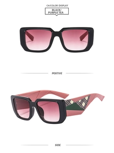 Detail view of square oversized sunglasses in black frame with purple tea gradient lenses