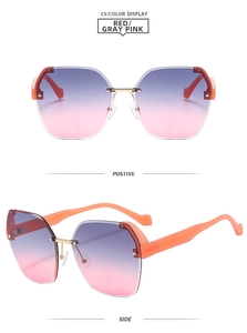 Detail view of purple-pink gradient rimless sunglasses with orange temples and gold metal