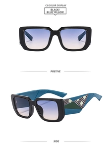 Detail of square oversized sunglasses with blue-yellow gradient lenses and plaid temples