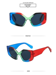 Detail view of rainbow polygon sunglasses with blue and red gradient resin frames