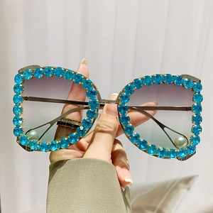Luxury oversized sunglasses with blue rhinestones, gradient lenses, and pearl details