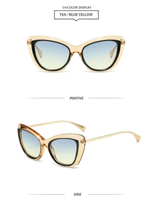 Detail view of retro cat-eye sunglasses with tea frames and blue-yellow gradient lenses