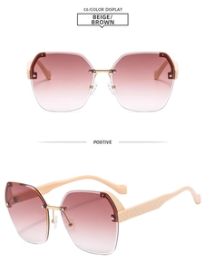 Detail of rimless rectangle sunglasses featuring brown gradient lenses and beige quilted arms