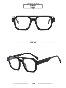 Detail view of retro double-bridge pilot frame in black finish with clear lenses