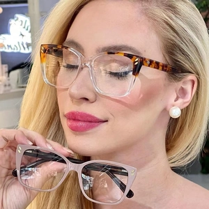Close-up of stylish square eyewear frames featuring metal M logo and contrast color detail
