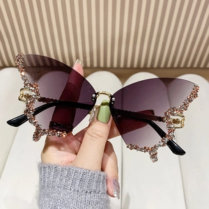 Frameless butterfly shape sunglasses with gradient purple lenses and sparkling rhinestones