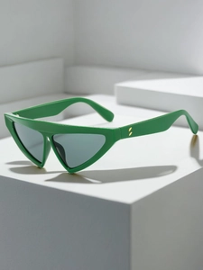 Detailed close-up of bright green triangle sunglasses with golden hinge accents