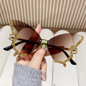 Oversized butterfly sunglasses with tea gradient lenses and gold rhinestone frame details