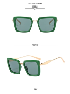 Detail view of square green sunglasses with gold metal temples and dark lenses
