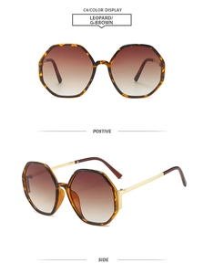 Detail of leopard print hexagonal sunglasses with golden metal temples and gradient brown lenses
