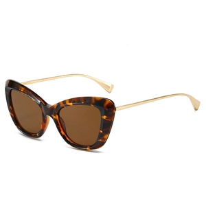 Retro cat-eye sunglasses with tortoiseshell frames and slim golden metal temples