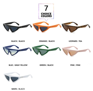 Flat lay of cat eye triangle sunglasses in seven colors with metal temple detail