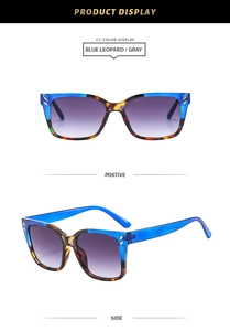 Detail view of square sunglasses with blue leopard frames and gradient lenses