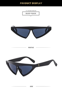 Detail view of black cat-eye triangle sunglasses with side golden dot accents