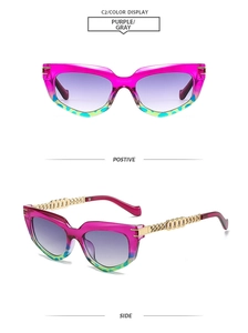 Detail of cat eye sunglasses with purple frame and gold chain metal temples
