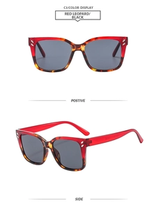 Detail of square sunglasses frame with red leopard pattern and silver metal rivets