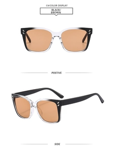 Detail view of square frame sunglasses with black gradient frames and brown lenses