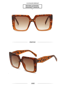 Detail view of square leopard print sunglasses with brown gradient lenses and metal accents