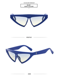 Detail of blue cat-eye sunglasses featuring unique gold dots and gradient lenses