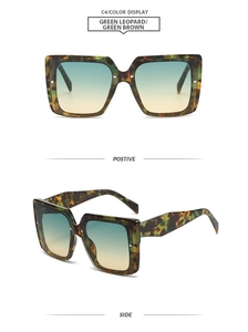 Detail of square green leopard frame sunglasses with gradient blue and brown lenses