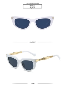Detail view of white cat-eye sunglasses with unique golden chain-link metal temples