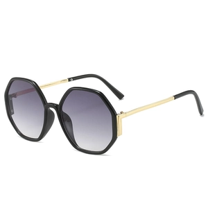 Fashionable oversized hexagonal sunglasses with black frames and gradient lenses