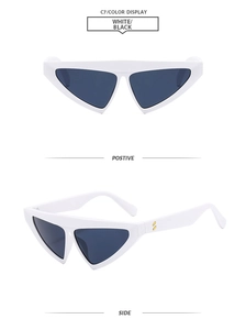 Detailed view of triangle cat eye sunglasses with white frames and gold hinge accents