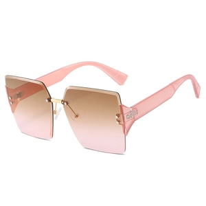 Fashionable square frameless sunglasses with pink gradient lenses and gold metal bridge