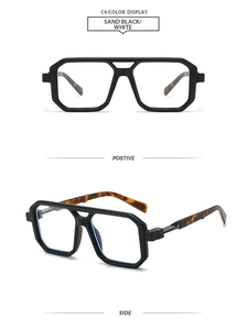Detail view of square double-bridge pilot sunglasses in matte black and tortoise shell