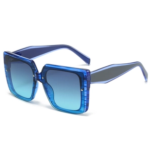 Fashion square sunglasses with transparent blue frames and blue-green gradient lenses