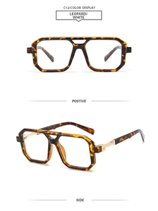 Detail of retro aviator glasses featuring leopard print frames and gold metal hinges