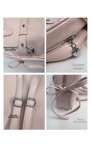 Detail view of pink backpack featuring heart charms, custom zippers, and ribbon accents