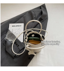 Top view of white leather bucket bag interior showing spacious storage capacity