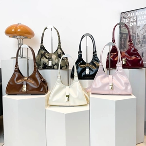 Minimalist faux leather hobo bags in six colors with stylish gold buckles on display