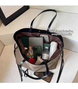 Top-down view showing spacious interior and compartments of a khaki canvas tote bag